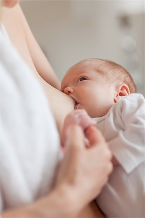 Small newborn getting lactated Stock Photo - Budget Royalty-Free & Subscription, Code: 400-05741255