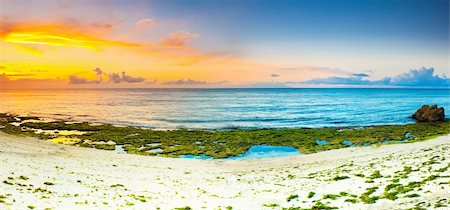 Sunrise over the sea. Stone on the foreground. Panorama Stock Photo - Budget Royalty-Free & Subscription, Code: 400-05741367