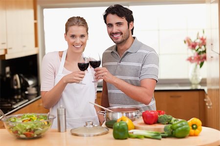 simsearch:400-05740111,k - Couple drinking a glass of red wine in their kitchen Stock Photo - Budget Royalty-Free & Subscription, Code: 400-05741858