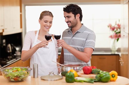 simsearch:400-05740111,k - Couple drinking a glass of wine in their kitchen Stock Photo - Budget Royalty-Free & Subscription, Code: 400-05741859