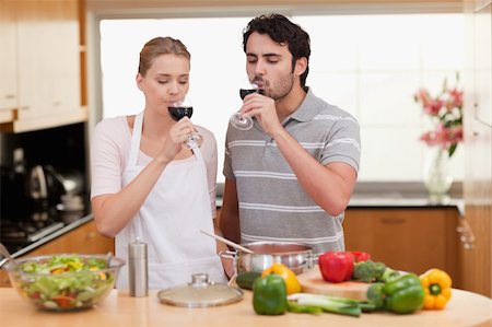 simsearch:400-05740111,k - Young couple drinking a glass of wine in their kitchen Stock Photo - Budget Royalty-Free & Subscription, Code: 400-05741860
