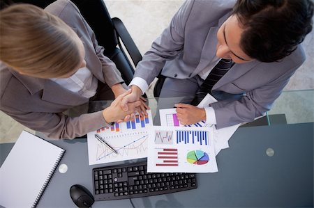 simsearch:400-05710386,k - Business team agreeing on a deal in a meeting room Stock Photo - Budget Royalty-Free & Subscription, Code: 400-05741967