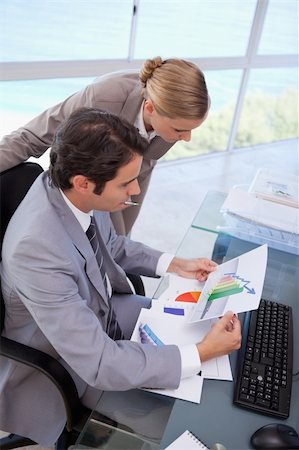 simsearch:400-05710386,k - Portrait of a manager and her secretary looking at a graph in his office Stock Photo - Budget Royalty-Free & Subscription, Code: 400-05741975
