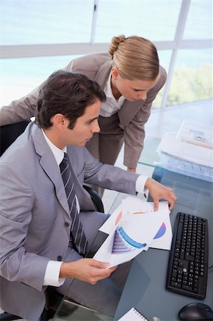 simsearch:400-05710386,k - Portrait of a manager and his secretary looking at a graph in his office Stock Photo - Budget Royalty-Free & Subscription, Code: 400-05741976