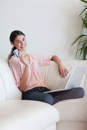 simsearch:400-04410667,k - Portrait of a delighted woman shopping online in her living room Stock Photo - Budget Royalty-Free & Subscription, Code: 400-05742012