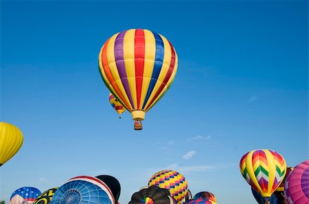 simsearch:400-06642893,k - Hot-air balloons ascending over inflating ones on the ground Foto de stock - Super Valor sin royalties y Suscripción, Código: 400-05742478
