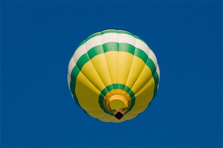 simsearch:400-06642893,k - Green, white and yellow hot-air balloon airborne, shot from beneath Foto de stock - Super Valor sin royalties y Suscripción, Código: 400-05742479