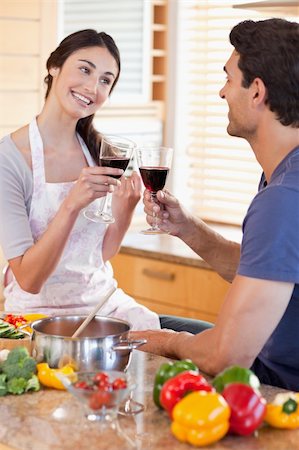 simsearch:400-05740111,k - Portrait of a couple having a glass of red wine while cooking in their kitchen Stock Photo - Budget Royalty-Free & Subscription, Code: 400-05742637
