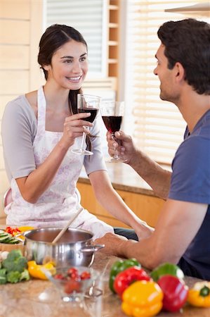 simsearch:400-05740111,k - Portrait of a couple having a glass of wine while cooking in their kitchen Stock Photo - Budget Royalty-Free & Subscription, Code: 400-05742638