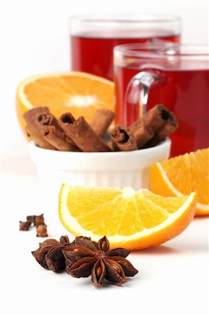 Mulled wine with oranges, cinnamon, anise and clove isolated on white background. Shallow dof Stock Photo - Budget Royalty-Free & Subscription, Code: 400-05743415