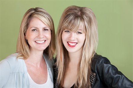 simsearch:400-05918419,k - Happy mom and daughter smile over green background Stock Photo - Budget Royalty-Free & Subscription, Code: 400-05751351