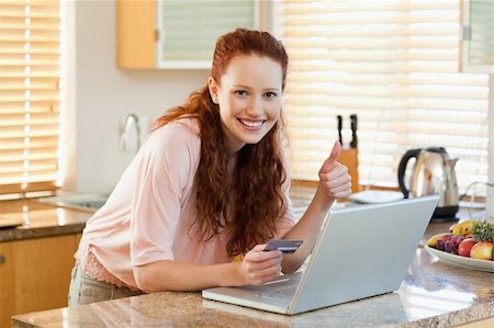 Smiling woman in the kitchen found a great online Stock Photo - Budget Royalty-Free & Subscription, Code: 400-05751482