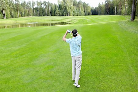simsearch:400-05753039,k - Man plays golf on the golf course Photographie de stock - Aubaine LD & Abonnement, Code: 400-05753055