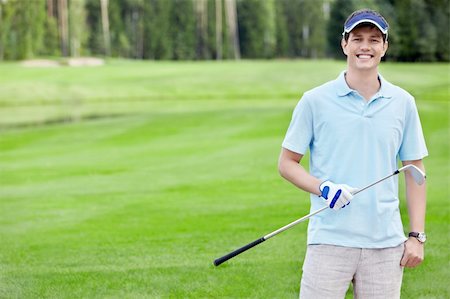 simsearch:400-05753044,k - Smiling Golfer on the golf course Stock Photo - Budget Royalty-Free & Subscription, Code: 400-05753059