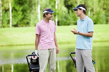 simsearch:400-05753062,k - Young man talking on the golf course Stock Photo - Budget Royalty-Free & Subscription, Code: 400-05753064