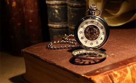 pocket watch - Still life with stylish pocket watch on ancient book Stock Photo - Budget Royalty-Free & Subscription, Code: 400-05753783