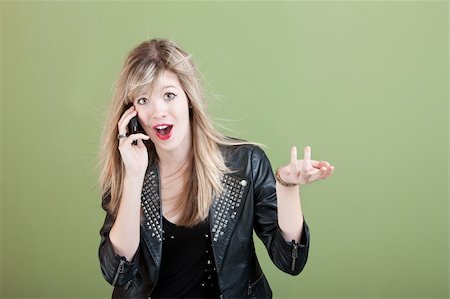 simsearch:400-05918419,k - Pretty retro-styled teen on phone call over green background Stock Photo - Budget Royalty-Free & Subscription, Code: 400-05753821