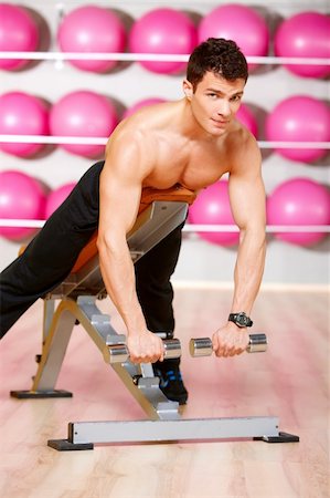 simsearch:400-05268701,k - Handsome man at the gym doing exercises Foto de stock - Super Valor sin royalties y Suscripción, Código: 400-05875709