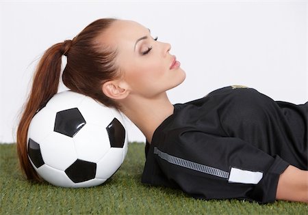 foot model - Beautiful and sporty woman resting on soccer ball Photographie de stock - Aubaine LD & Abonnement, Code: 400-05875852