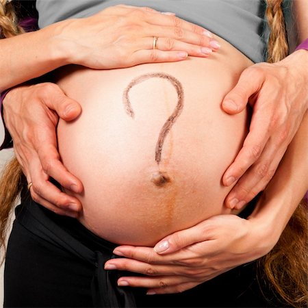 simsearch:400-04866555,k - question. Male and female hands are embracing stomach of a pregnant woman on gray background with caption on stomach Foto de stock - Super Valor sin royalties y Suscripción, Código: 400-05876123