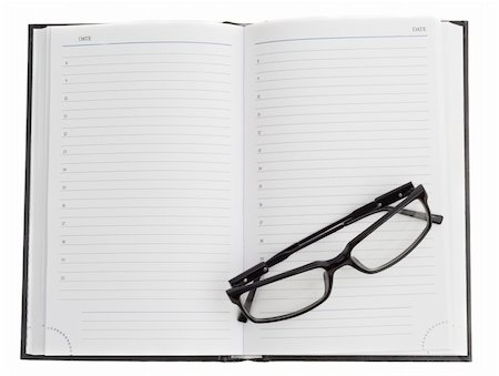 simsearch:6109-08395080,k - open dayplanner and optical black glasses on the page Stock Photo - Budget Royalty-Free & Subscription, Code: 400-05876394