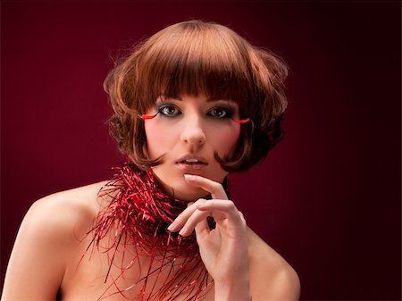 simsearch:400-04653285,k - Beautiful girl with glamour make-up, over on red background Photographie de stock - Aubaine LD & Abonnement, Code: 400-05877552