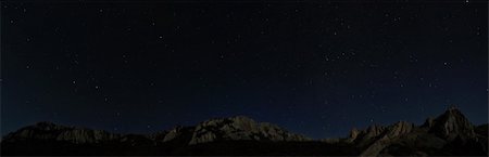 Starry night sky above rocky cliffs. Natural stars panorama photo Stock Photo - Budget Royalty-Free & Subscription, Code: 400-05878221