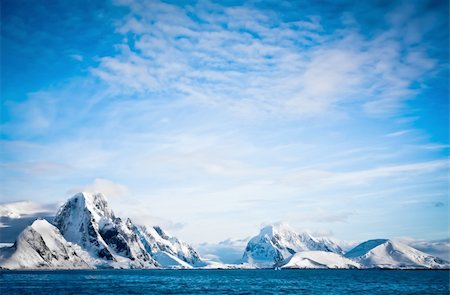 Beautiful snow-capped mountains against the blue sky Stock Photo - Budget Royalty-Free & Subscription, Code: 400-05878292