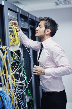 simsearch:400-05881495,k - young handsome business man  engeneer in datacenter server room Stock Photo - Budget Royalty-Free & Subscription, Code: 400-05878621