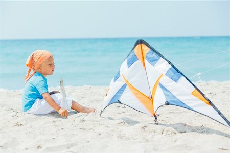 pictures of boy fly kites in the sky - Little cute boy playing with a colorful kite on the tropical beach. Stock Photo - Budget Royalty-Free & Subscription, Code: 400-05879038