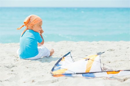 pictures of boy fly kites in the sky - Little cute boy playing with a colorful kite on the tropical beach. Stock Photo - Budget Royalty-Free & Subscription, Code: 400-05879095