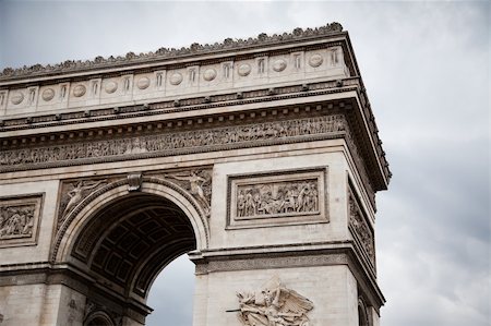 simsearch:400-06924255,k - Arc de Triomphe (Arch of Triumph) on gloomy sky background Stock Photo - Budget Royalty-Free & Subscription, Code: 400-05885123