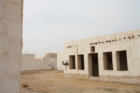 Empty buildings in the desert town of Al Wakrah (Al Wakra), Qatar, in the Middle East Stock Photo - Budget Royalty-Free & Subscription, Code: 400-05885450