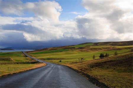 Road in bright green fields and hills in Iceland Stock Photo - Budget Royalty-Free & Subscription, Code: 400-05888217
