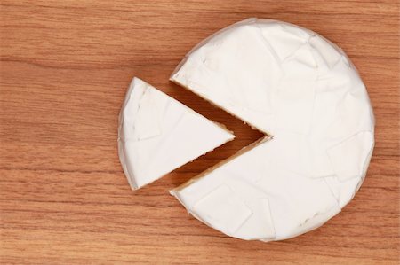 Round camembert cheese, with a wedge cut out to form a diagram Stock Photo - Budget Royalty-Free & Subscription, Code: 400-05888979