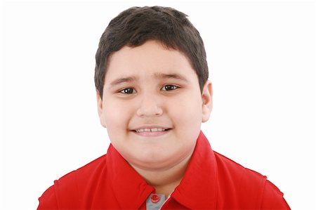 simsearch:400-04594888,k - Boy looking at the camera with a small smile over white background Stock Photo - Budget Royalty-Free & Subscription, Code: 400-05889059