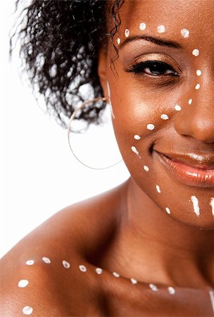 Half face of Happy smiling beautiful indigenous African tribal woman with white dots and lines makeup, isolated. Stock Photo - Budget Royalty-Free & Subscription, Code: 400-05889198