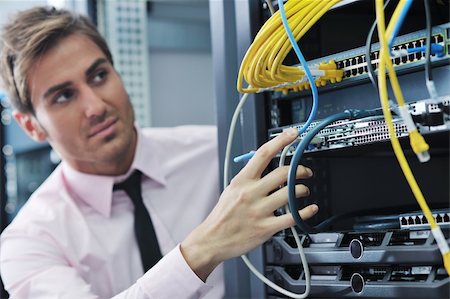 simsearch:400-05881495,k - young handsome business man  engeneer in datacenter server room Stock Photo - Budget Royalty-Free & Subscription, Code: 400-05881495