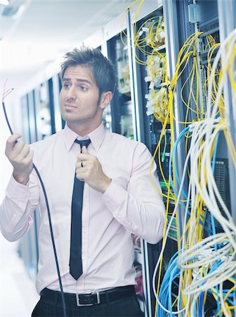 simsearch:400-05291415,k - young handsome business man  engeneer in datacenter server room Stock Photo - Budget Royalty-Free & Subscription, Code: 400-05881499
