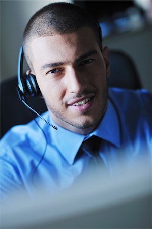 face to internet technology - businessman with a headset portrait at bright call center helpdesk support office Photographie de stock - Aubaine LD & Abonnement, Code: 400-05881514