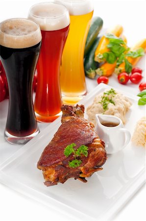 simsearch:400-04684204,k - original German BBQ pork  knuckle served with mashed potatoes and  sauerkraut ,with selection of beers and fresh vegetables on background,MORE DELICIOUS FOOD ON PORTFOLIO Photographie de stock - Aubaine LD & Abonnement, Code: 400-05881894