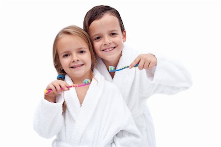 simsearch:400-04151137,k - Happy and clean kids washing teeth wearing batrobes - isolated Photographie de stock - Aubaine LD & Abonnement, Code: 400-05882579