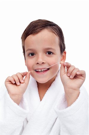 dental floss - Little boy flossing his teeth - oral hygiene education concept Stock Photo - Budget Royalty-Free & Subscription, Code: 400-05882581