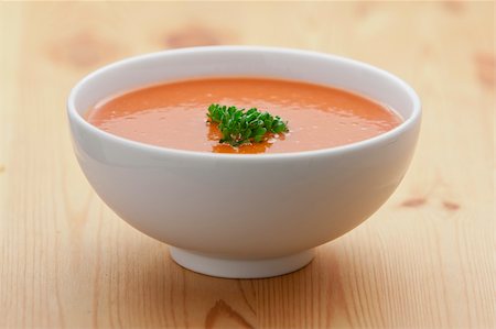 Spanish cold tomato based soup gazpacho served in a white bowl Stock Photo - Budget Royalty-Free & Subscription, Code: 400-05882880