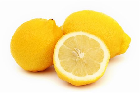 simsearch:400-04716078,k - yellow lemons slice pile isolated on white Stock Photo - Budget Royalty-Free & Subscription, Code: 400-05882936