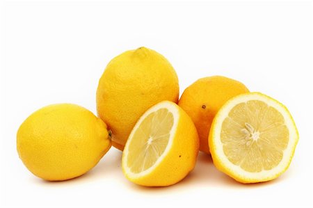 simsearch:400-04716078,k - yellow lemons slice pile isolated on white Stock Photo - Budget Royalty-Free & Subscription, Code: 400-05882938