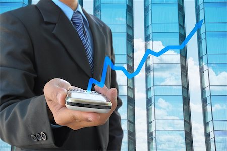 simsearch:700-05452103,k - businessman hand holding mobile phone and business graph Stock Photo - Budget Royalty-Free & Subscription, Code: 400-05883485