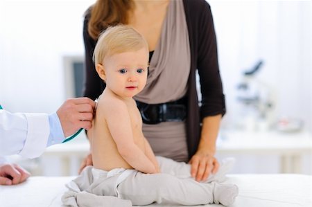 Portrait of lovely baby being checked by pediatrician using a stethoscope Stock Photo - Budget Royalty-Free & Subscription, Code: 400-05883601