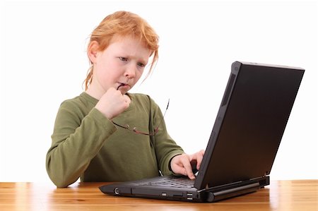 face to internet technology - Portrait of a thinking girl working on a laptop computer Stock Photo - Budget Royalty-Free & Subscription, Code: 400-05894550