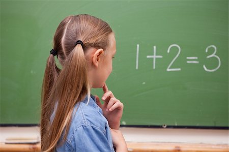 simsearch:625-01250891,k - Little schoolgirl thinking while looking at the blackboard Stock Photo - Budget Royalty-Free & Subscription, Code: 400-05894746